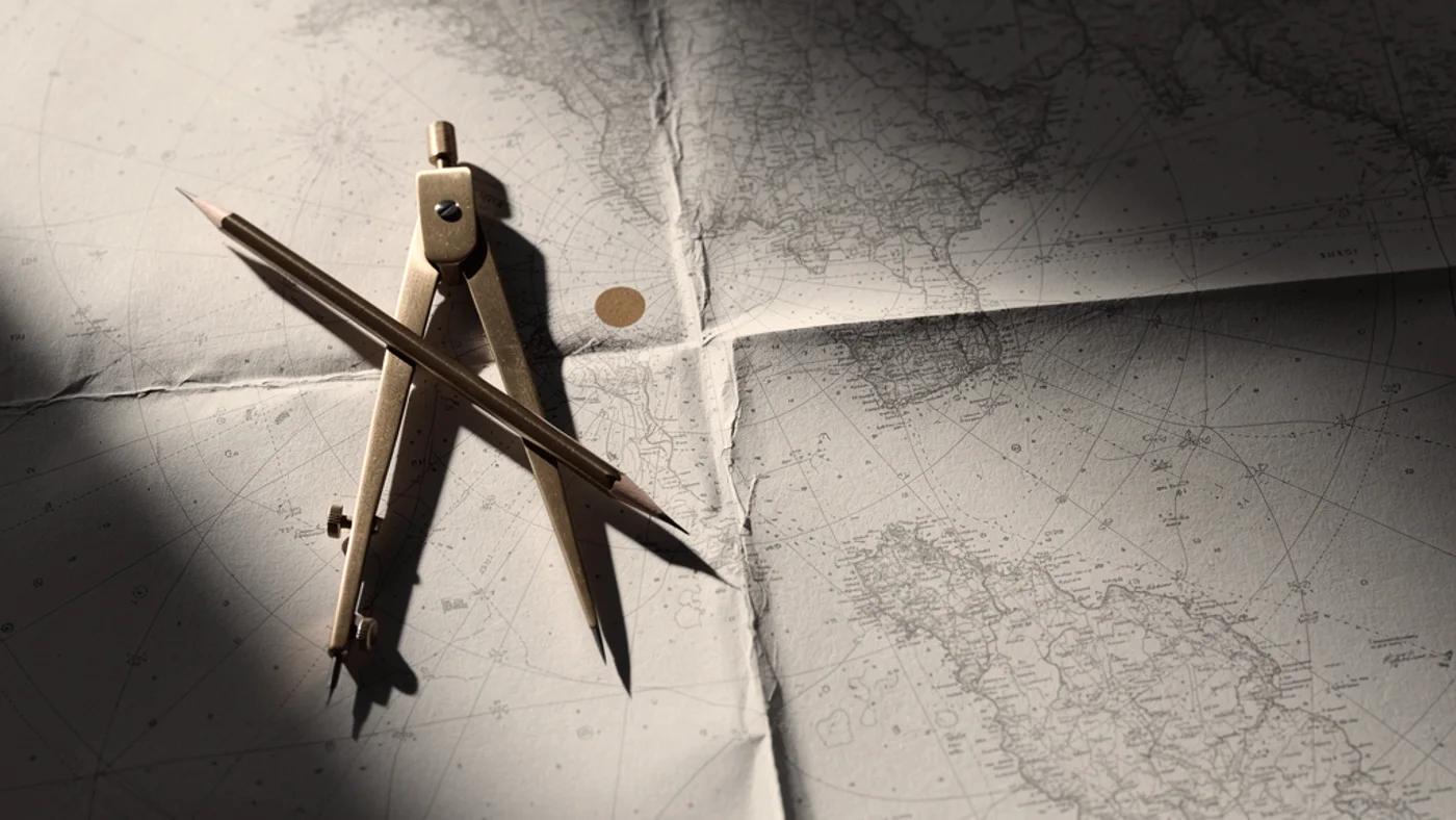 Brass drawing dividers and a pencil resting on an old nautical chart, a route marked between two points